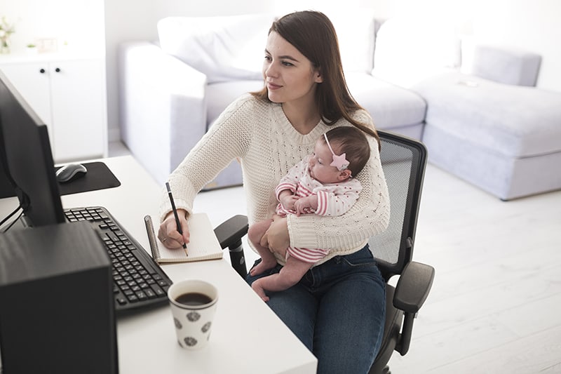 A woman working with a baby
